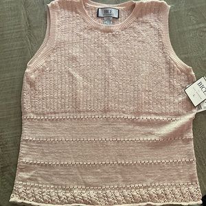 New with tags beautiful knit tank in a light pink/peach color.